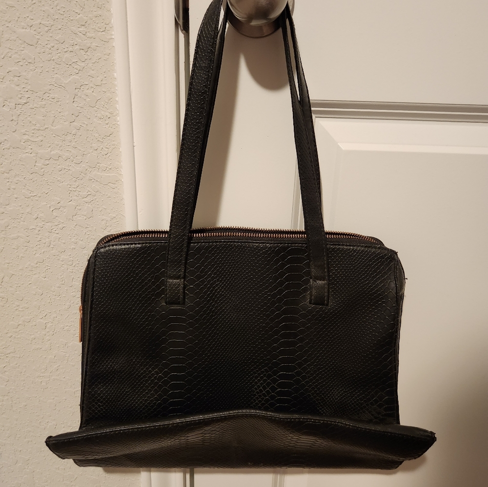 Women's Kardashian Beauty black laptop bag.
